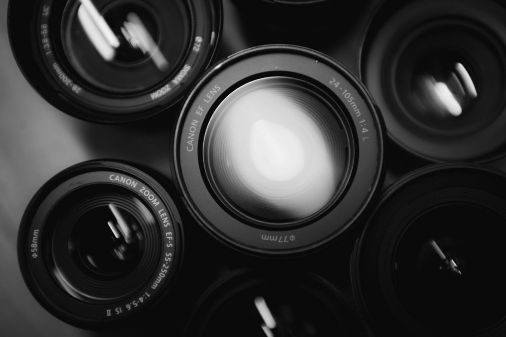 Photo by Hunter Moranville six black zoom lenses